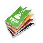 Stack of kyodai firm-tip brush pens in green orange red and black packaging for precise skin marker use