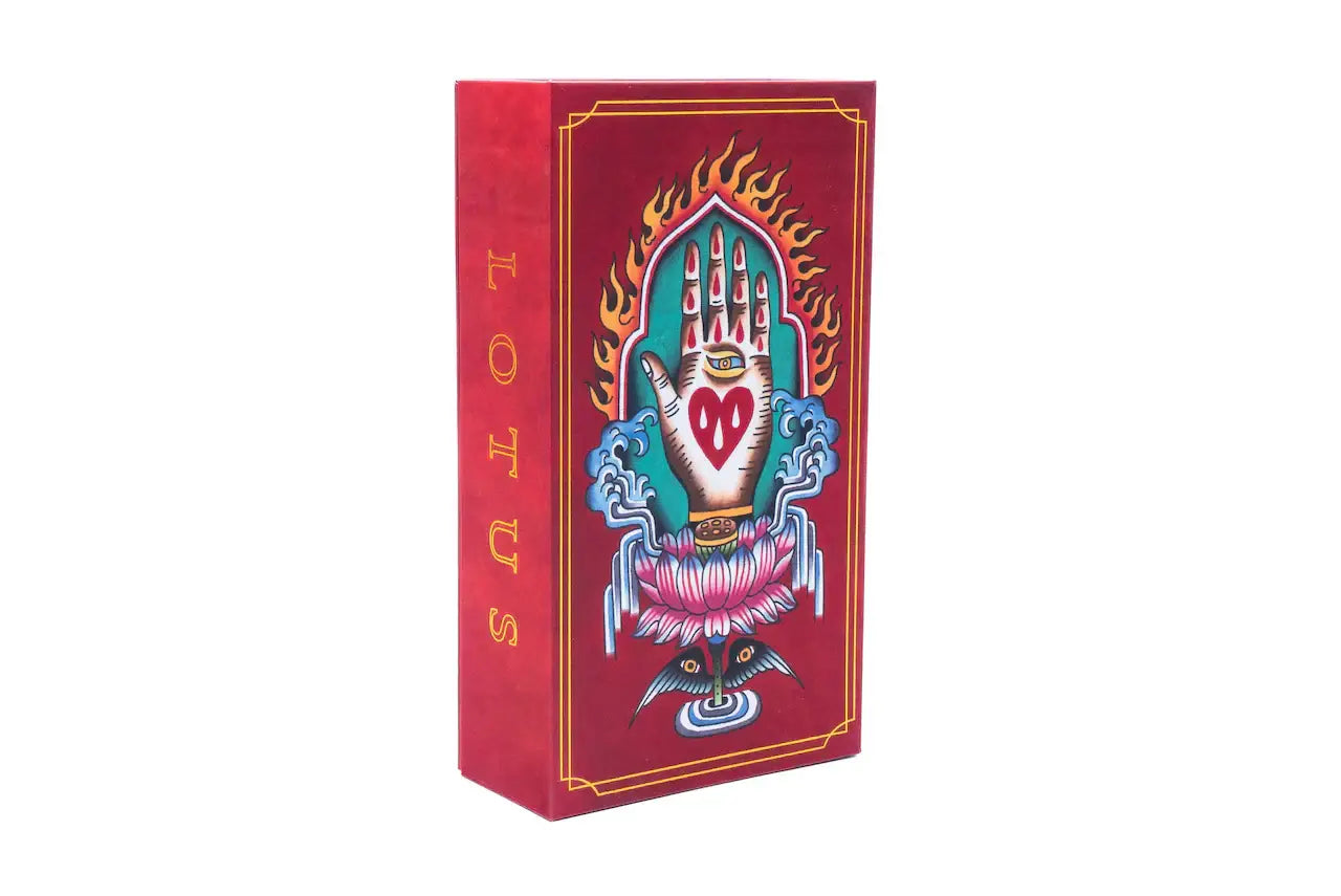 Red rectangular box of lotus bar needles featuring gold lettering and artwork of a hand holding a heart with flames and lotus petals
