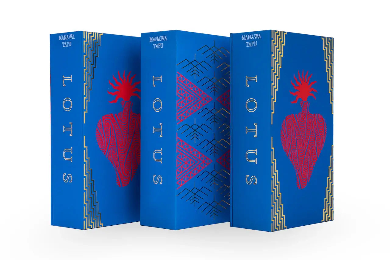 Blue hardcover books titled lots by manawa tapu with red heart illustrations and gold geometric borders for lotus bar needles