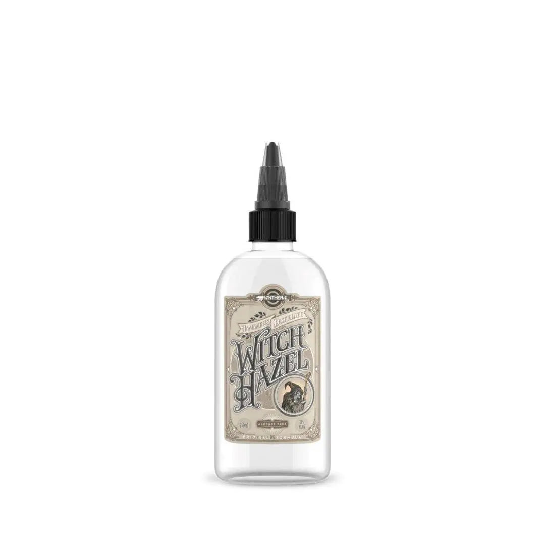 Clear glass bottle of Panthera witch hazel 150ml with black dropper cap and vintage label featuring witch illustration