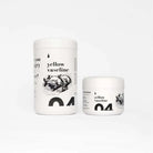 Two white cylindrical containers of yellow vaseline with black minimalist fish labels from piranha 250ml product line