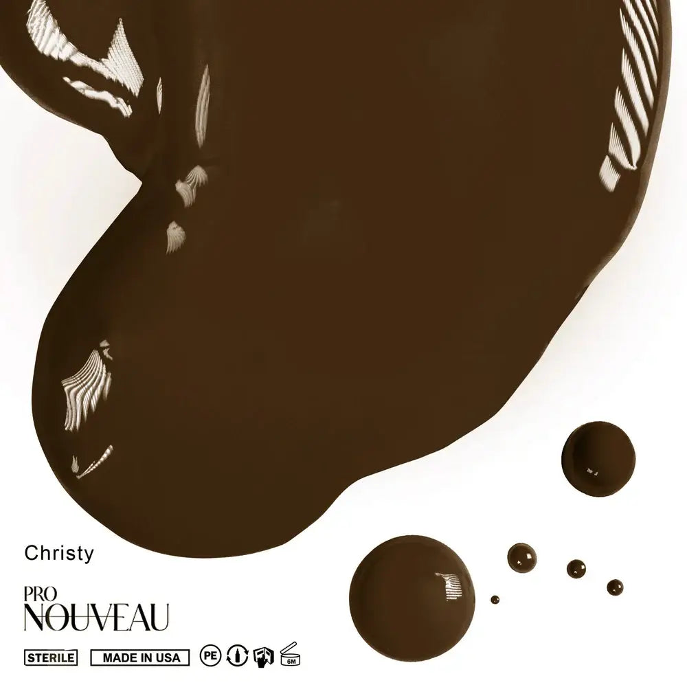 A rich dark brown glossy paint spill with white feather patterns from pro nouveau brows collection pmu pigment christy