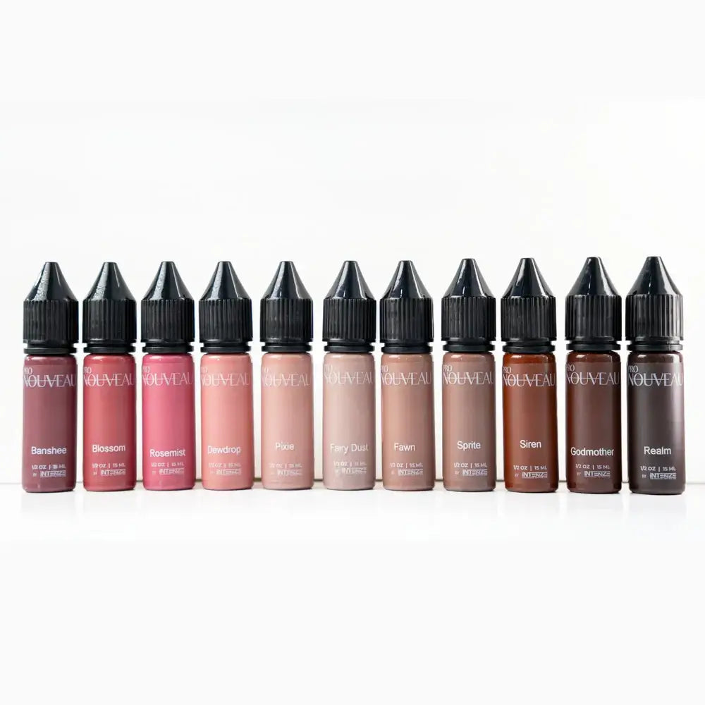 A row of ten nouveau brand liquid lipsticks in transparent glass bottles with black caps and pigment names like banshee and blossom