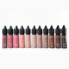 A row of ten nouveau brand liquid lipsticks in transparent glass bottles with black caps and names like banshee and blossom