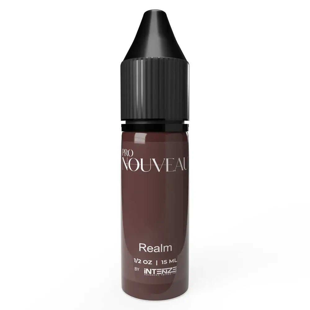 A sleek dark brown glass bottle with black ribbed cap labeled pro nouveau realm by intenze pmu pigment nipple fairy