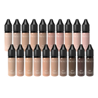 Eine Kollektion aus zwanzig Nouveau Pro PMU Pigment-Foundation-Fläschchen in verschiedenen Hauttönen mit schwarzen konischen Kappen