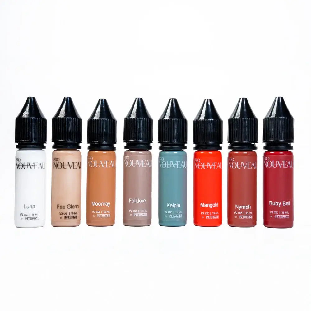 Seven small sleek bottles of pro nouveau pmu pigment second story e-liquid in assorted colors from white to red