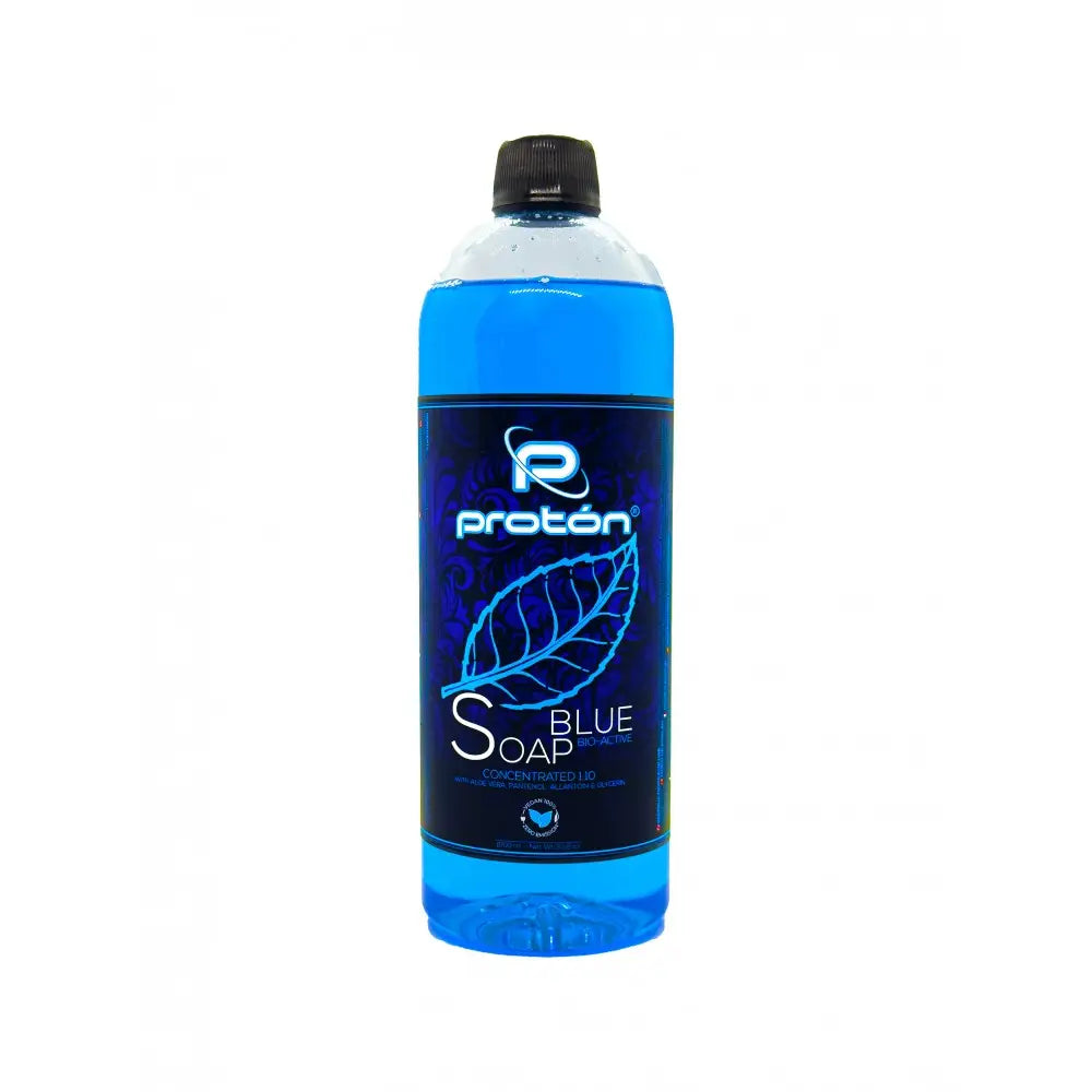 A translucent blue bottle of proton blue soap concentrated with panthenol alantoin and aloe vera with black cap and glowing leaf label
