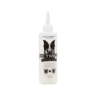 White plastic bottle with white nozzle labeled petrify ink sponge super absorbent polymer for water-based liquid cleanup
