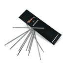 Black rectangular killer ink box with silver dermograph pen needles fanned beside it for skin doodlers skin surfer pens