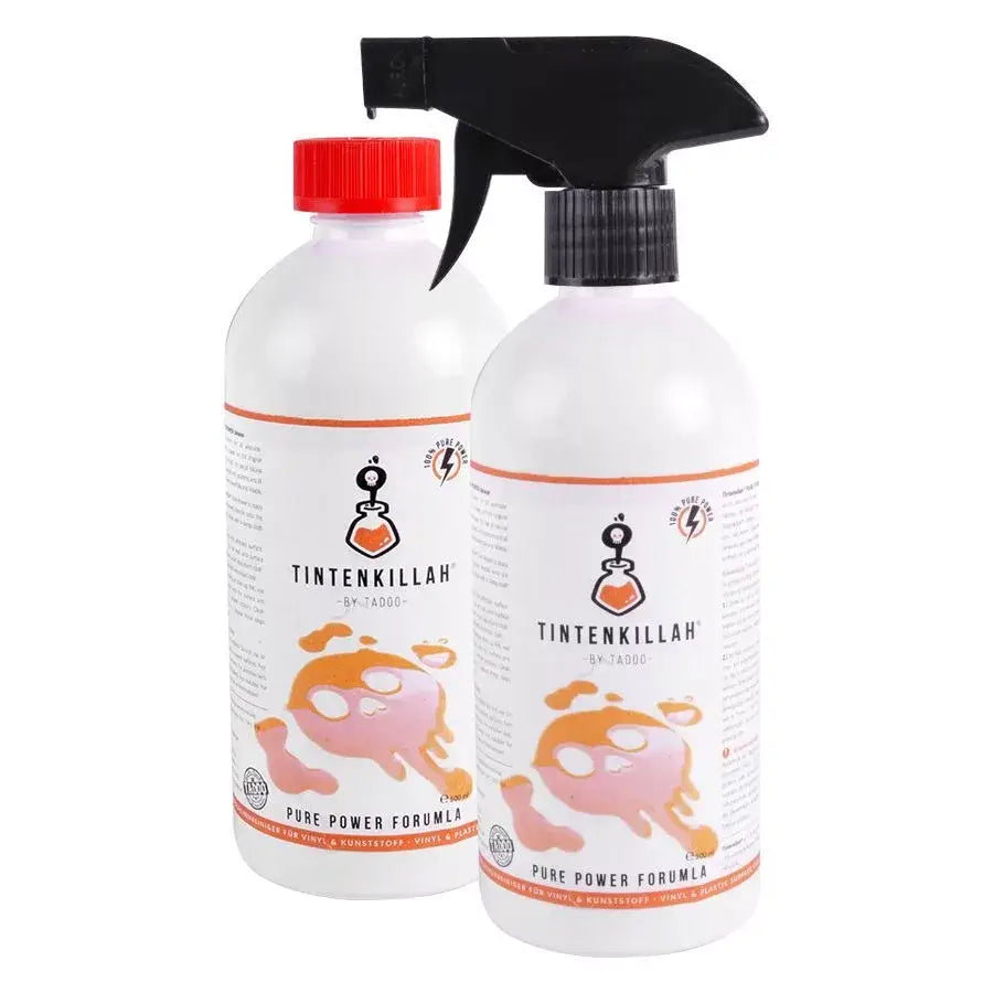 White plastic spray bottles with black and red caps labeled tintenkillah by tadoo featuring orange and pink splatter graphics