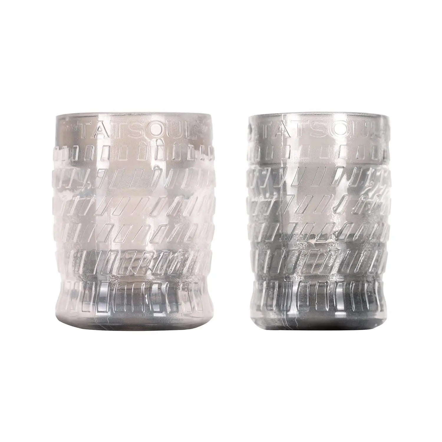Two translucent silver glass candle holders with embossed geometric patterns.