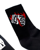Black vice attitude sock with white and red embroidered burning cash graphic for casual streetwear use