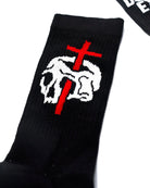 Black knit vice attitude socks featuring a white skull with a red cross stitched on the front no religion design