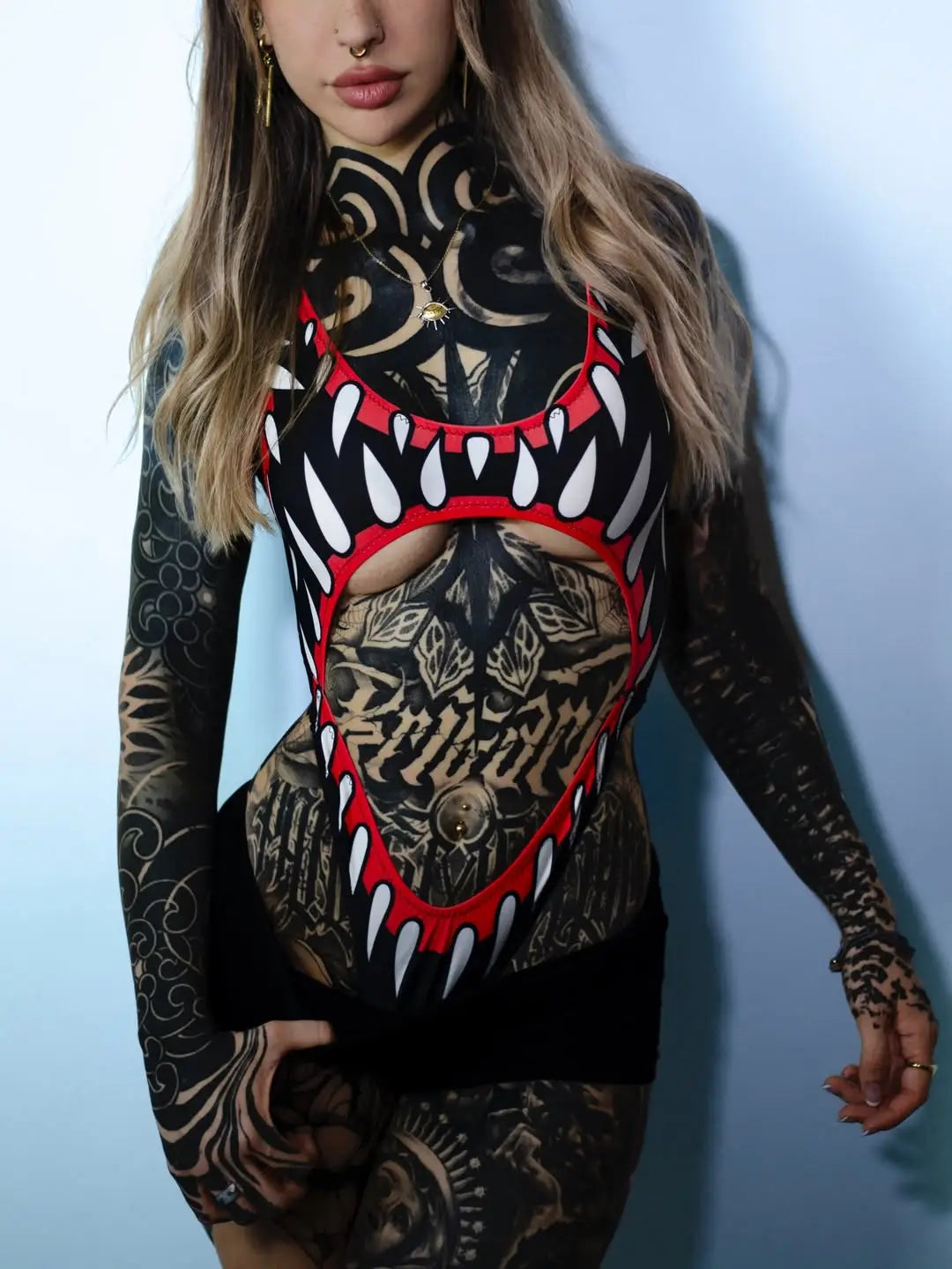 Black and red graphic bodysuit trikini with white teeth design from VICE ATTITUDE for bold swimwear looks