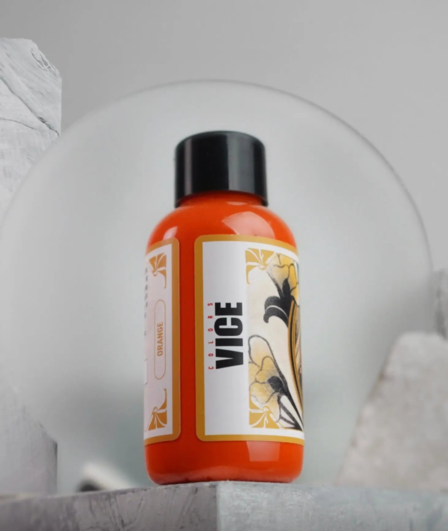 Vice orange fragrance oil in a glossy amber bottle with black cap and floral label from Daniels Bauti Set