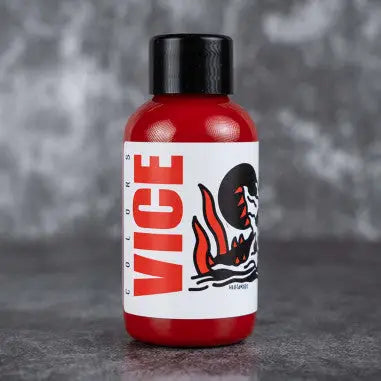 Red plastic bottle with black cap and white label featuring bold red vice text and a flaming skull graphic from vice red end