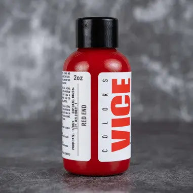 A vibrant red 2oz bottle of vice colors paint with black cap and white label featuring bold red branding