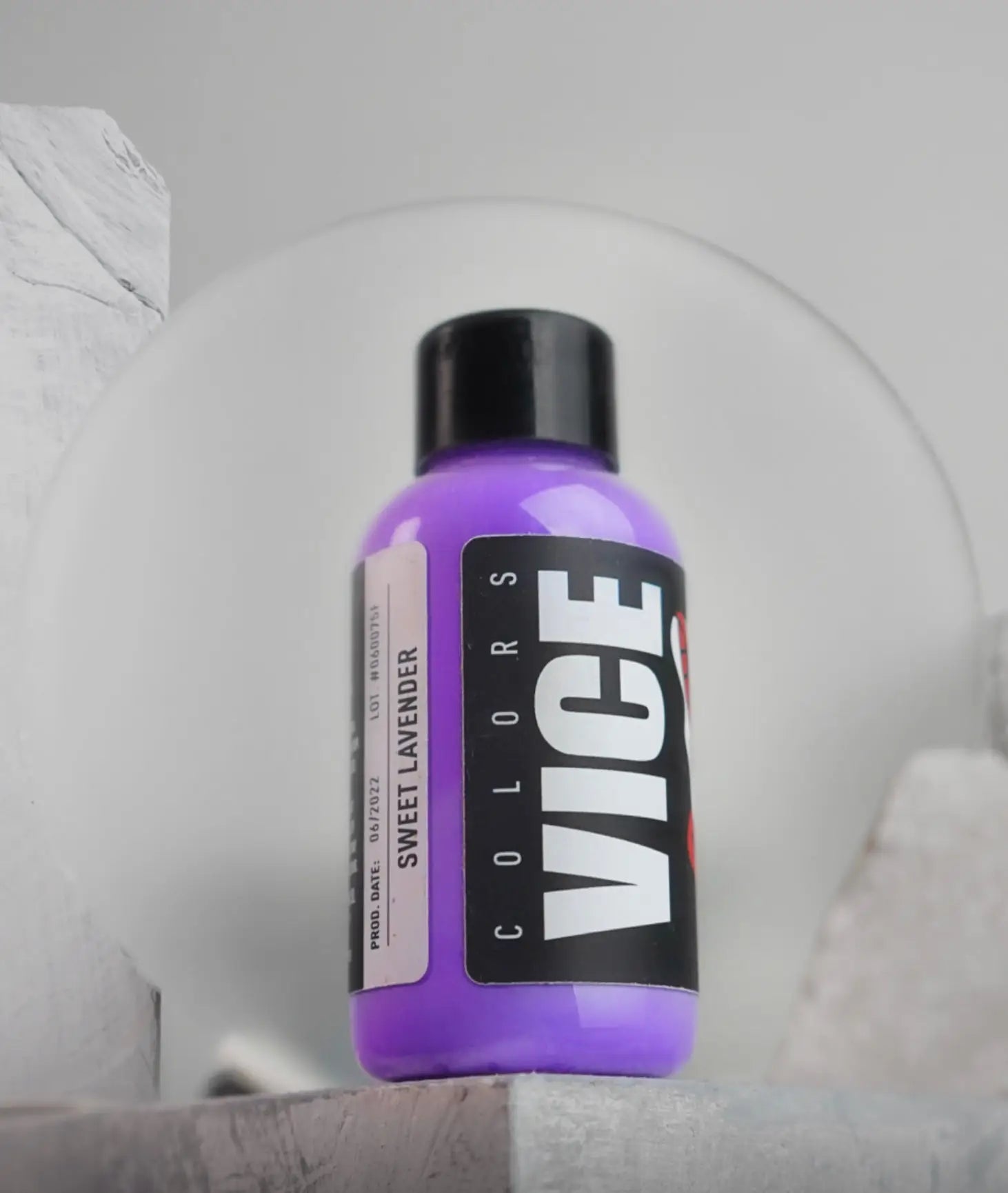 A vibrant purple bottle of vice colors sweet lavender paint with a black cap and bold white branding