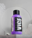A vibrant purple bottle of vice colors sweet lavender paint with a black cap and bold white branding