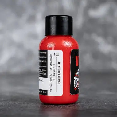 Red plastic bottle with black cap and sweet tangerine label by Voodoo from Vice product line