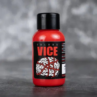 Red plastic bottle of vice sweet tangerine with black cap and label featuring bold red brand name above white brain graphic