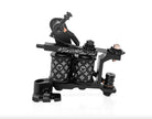 Schwarze VLAD BLAD Coil BUPS1 Pro Shader-Tätowiermaschine mit elegantem industriellem Design und Coil-Mustern mit Smiley-Gesicht