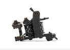 Machine à tatouer à bobine noire VLAD BLAD lbdl4 avec un design industriel élégant et des motifs monogrammes blancs sur les parties cylindriques