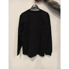 Vlad blad longsleeve vbi black black long-sleeved crewneck shirt hanging on a wooden hanger front view