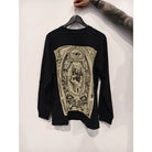 Vlad blad long-sleeve cotton tee in black with detailed beige graphic of eye hand gesture and ornate design