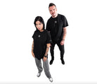 Black vlad blad shirt featuring a small white logo on the chest made of soft cotton material