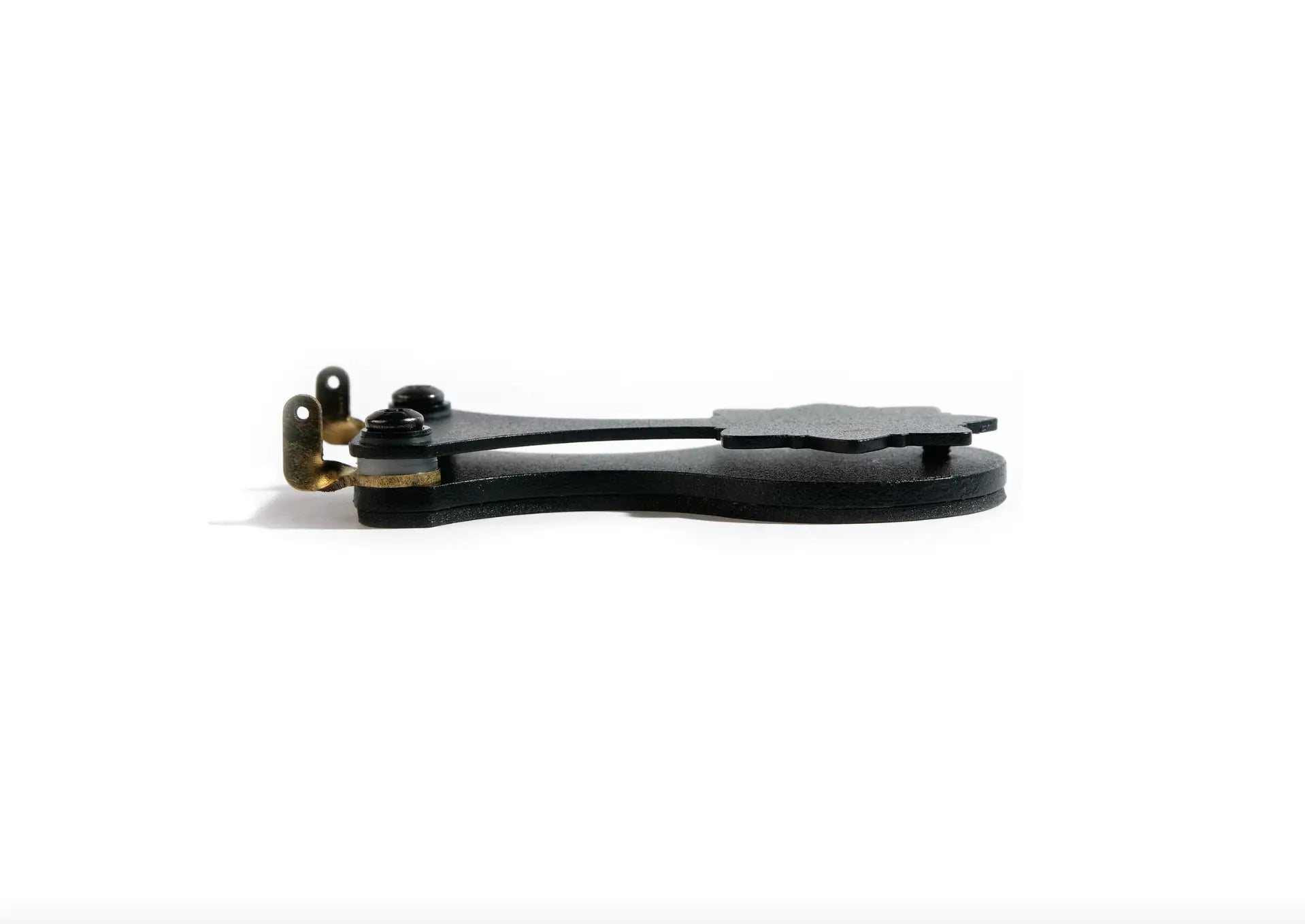 Black plastic clip with brass metal hardware on vlad blad ultralight footswitch for pedal control