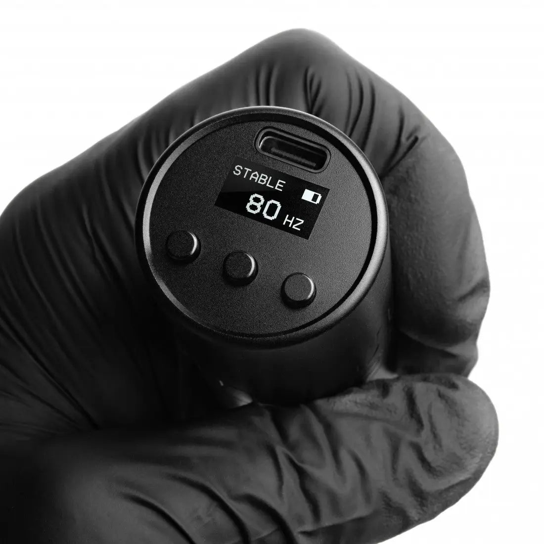 Black cylindrical VLAD BLAD Ultron 4 tattoo machine with digital display showing stable 80 Hz and three control buttons