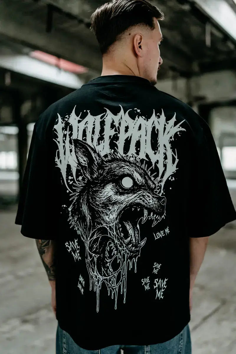 Black oversized unisex short-sleeved cotton tee with white snarling wolf graphic and wolfpack text design