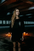 Black oversized unisex t-shirt with white embroidered dragon design on chest from wolfpack abyss hound collection