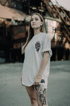 White oversized tee unisex with black wolf head graphic on left chest from wolfpack black ritual collection