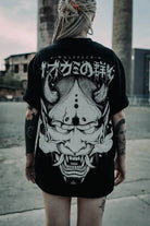 Black oversized tee unisex with white ornate horned demon mask graphic and stylized japanese characters on front