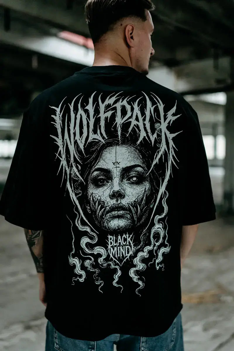 Black oversized unisex short-sleeved cotton tee with white wolfpack stylized face graphic and black mind text