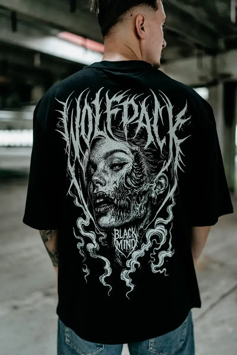 Black oversized unisex cotton t-shirt with white wolfpack zombie face graphic and black mind text for casual wear