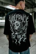 Schwarzes oversized Unisex-Baumwoll-T-Shirt mit weißem wolfpack-Zombiegesicht-Print und schwarzem Mind-Schriftzug für den Freizeitlook